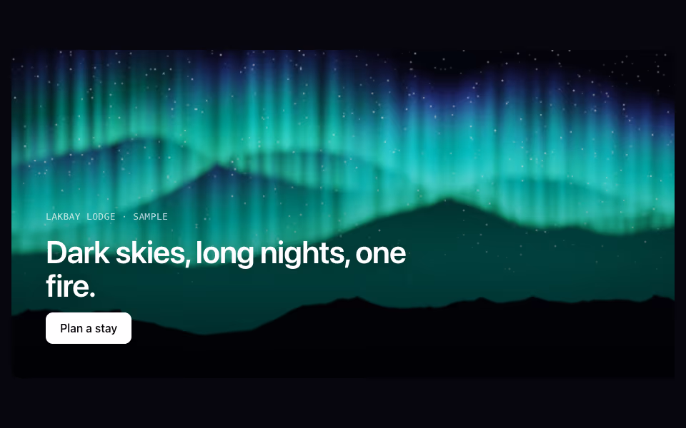 Green and violet aurora curtains over a mountain ridge and stars
