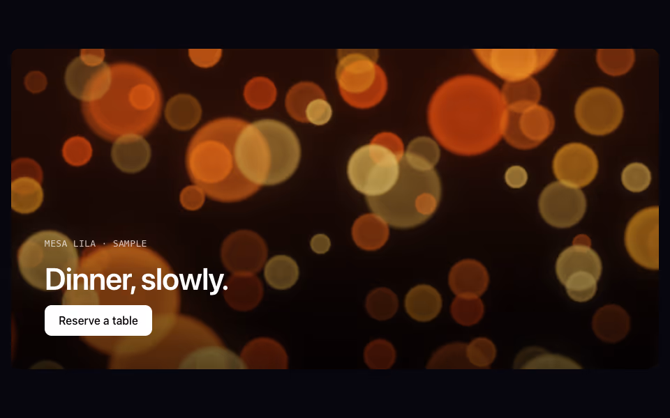 Warm amber bokeh lights of different sizes on a dark background