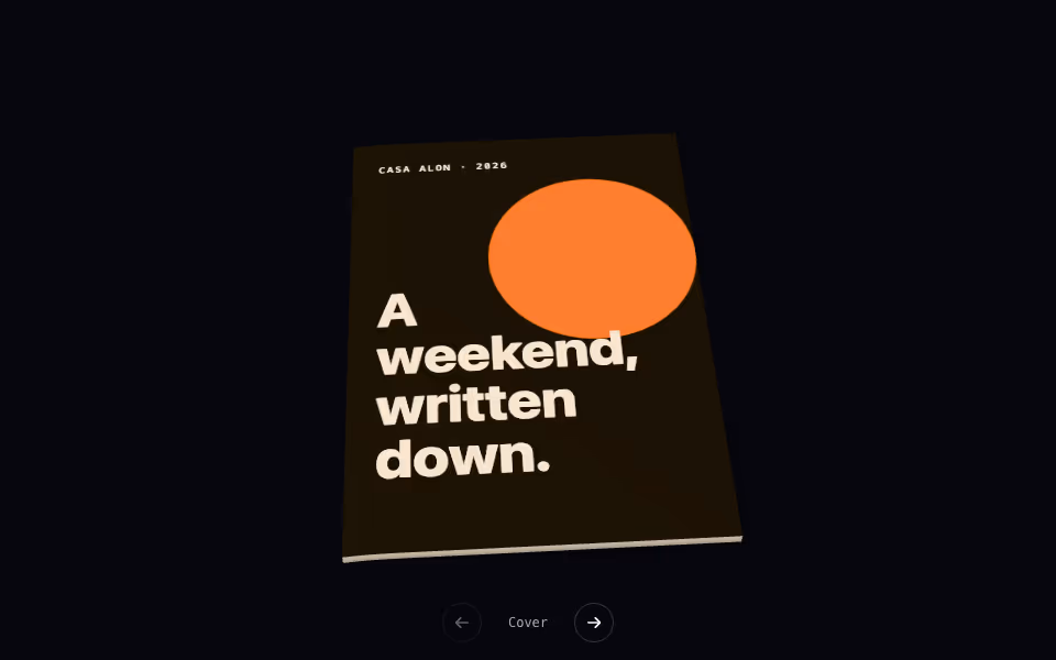 An open 3D brochure on a desk with a page turning and its corner lifted