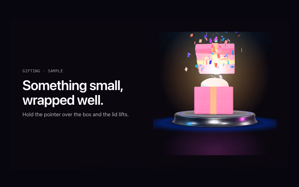 A pink gift box with a gold ribbon and bow, its lid lifting with confetti