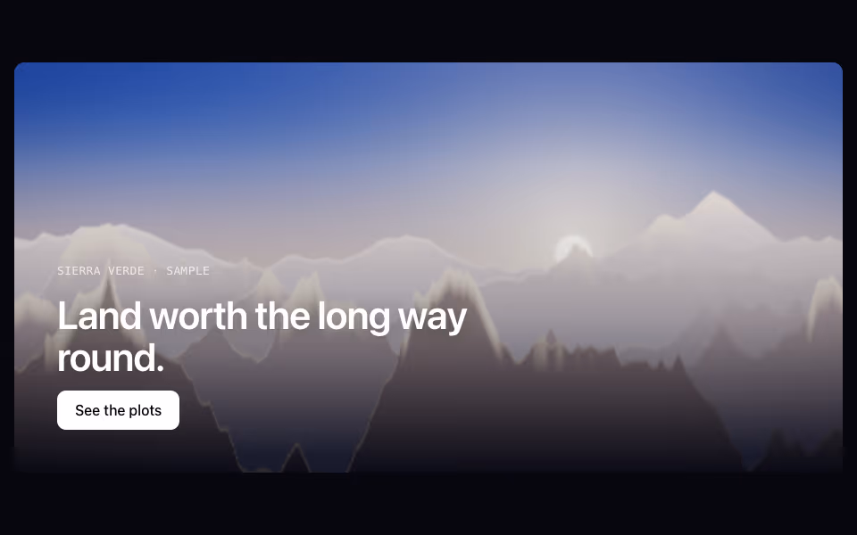 Layers of snow-capped mountains fading into a warm haze